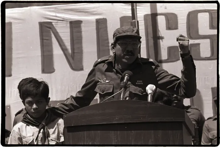 Framed Print : Commander Ortega Holds Child and Speaks Framed Print : Commander Ortega Holds Child and Speaks