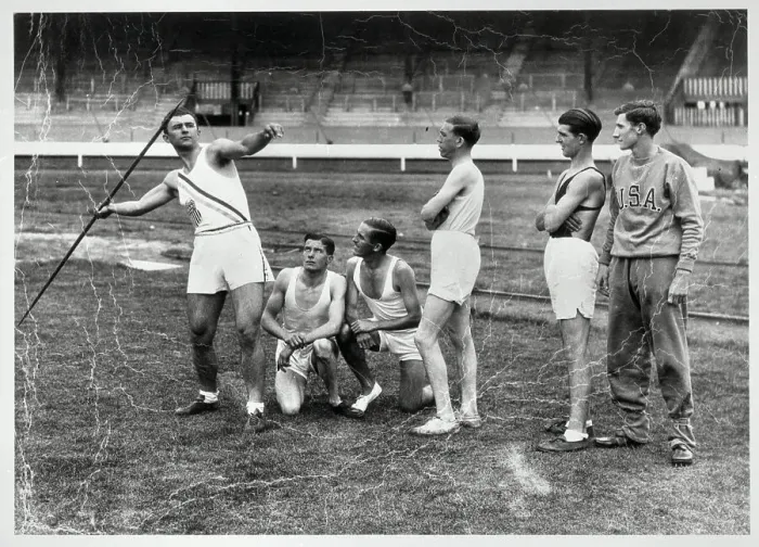 Framed Print : Competitors Watching Man Throw Javelin Framed Print : Competitors Watching Man Throw Javelin