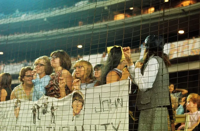 Framed Print : Concert Fans Standing Behind Mesh Barricade