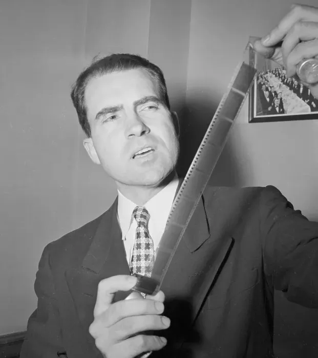 Framed Print : Congressional Representative Richard Nixon Holding Microfilm Strips Framed Print : Congressional Representative Richard Nixon Holding Microfilm Strips
