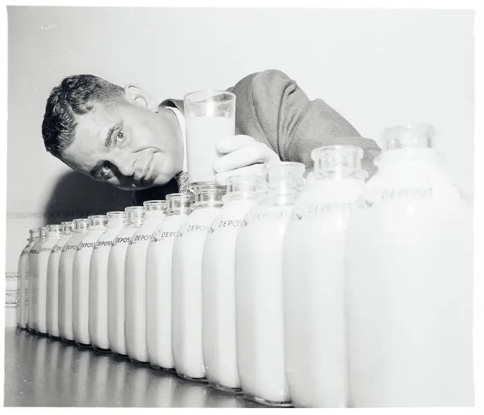 Framed Print : Conrado Asenjo Standing Behind Bottles of Juice