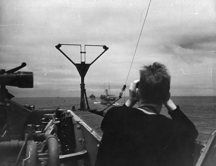 Framed Print : In Convoy. 11th September 1943: A British sailor scans the ships following Framed Print : In Convoy. 11th September 1943: A British sailor scans the ships following