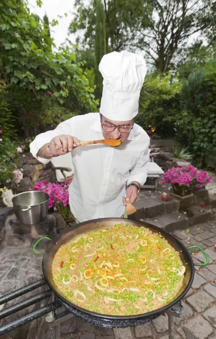 Framed Print : Cook preparing a paella, a Spanish rice dish, adding saffron, tasting, series, no. 1 Framed Print : Cook preparing a paella, a Spanish rice dish, adding saffron, tasting, series, no. 1
