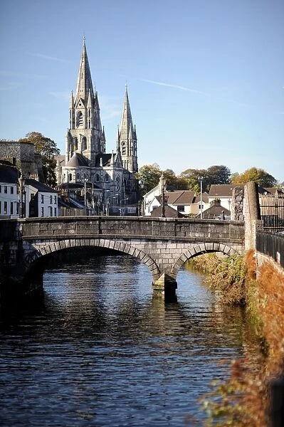 Cork City. A bridge across River Lee with St.Fin Barres Cathedral in the background