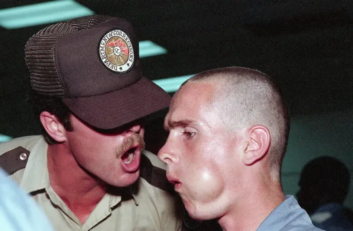 Framed Print : Corrections Officer Shouting at Inmate Framed Print : Corrections Officer Shouting at Inmate