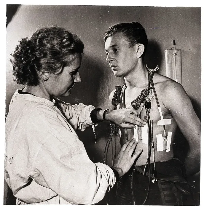 Framed Print : Cosmonaut Getting Sensors Taped to Chest Framed Print : Cosmonaut Getting Sensors Taped to Chest