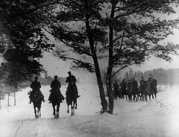 Cossacks. circa 1916: Russian cossacks riding through a forest
