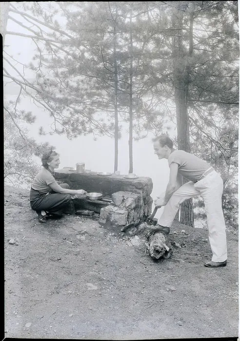 Framed Print : Couple Cooking While Camping Framed Print : Couple Cooking While Camping