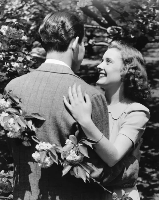 Framed Print : Couple embracing at blooming bush (B&W) Framed Print : Couple embracing at blooming bush (B&W)