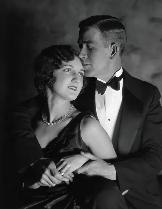 Framed Print : Couple in evening wear, embracing, woman looking up at man, man kissing woman's forehead Framed Print : Couple in evening wear, embracing, woman looking up at man, man kissing woman's forehead