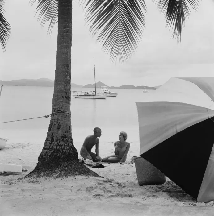 Framed Print : Couple having fun on beach, smiling Framed Print : Couple having fun on beach, smiling