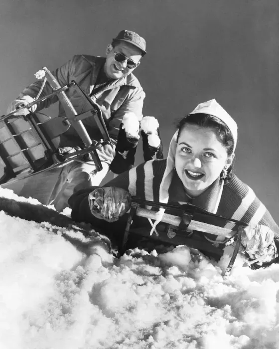Framed Print : Couple at top of hill, about to go sledding Framed Print : Couple at top of hill, about to go sledding
