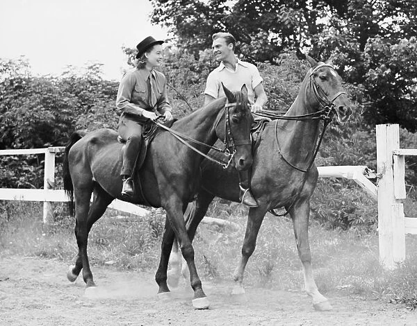 Couple horseback riding