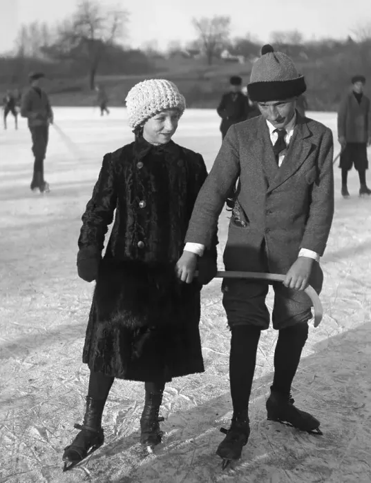 Framed Print : Couple ice skating on frozen lake