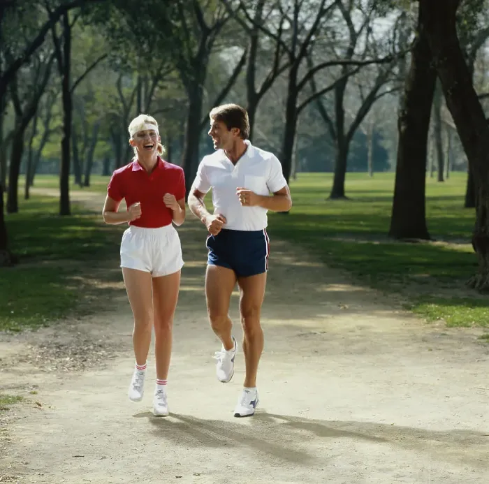 Framed Print : Couple jogging in park, smiling