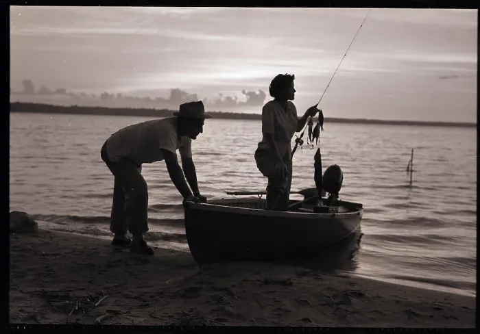 Framed Print : Couple on Lakeshore with Boat Framed Print : Couple on Lakeshore with Boat
