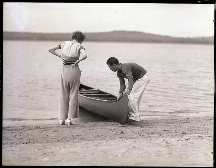 Framed Print : Couple Launching a Canoe Framed Print : Couple Launching a Canoe