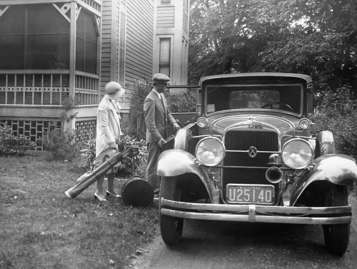 Framed Print : Couple Loading Baggage into Oldsmobile