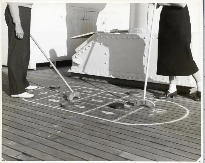 Framed Print : Couple Playing Shuffleboard Framed Print : Couple Playing Shuffleboard