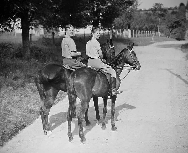 Couple riding horses (B&W), , portrait