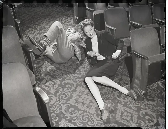 Framed Print : Couple Rolling in Aisle of Theater Framed Print : Couple Rolling in Aisle of Theater