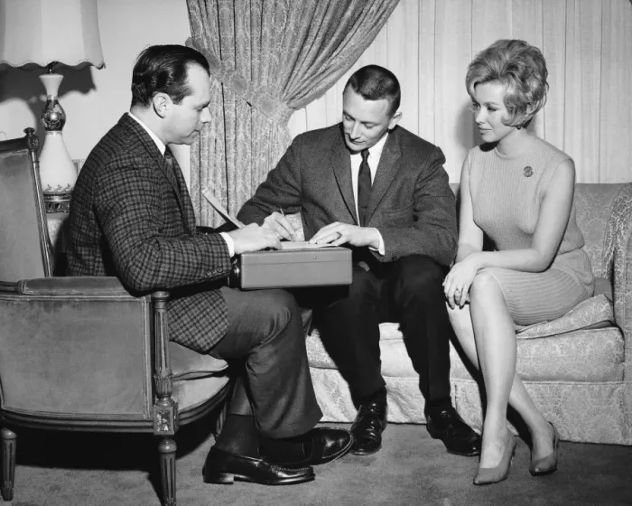 Framed Print : Couple with salesman Framed Print : Couple with salesman