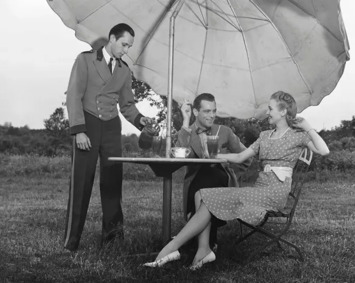 Framed Print : Couple being served by waiter Framed Print : Couple being served by waiter