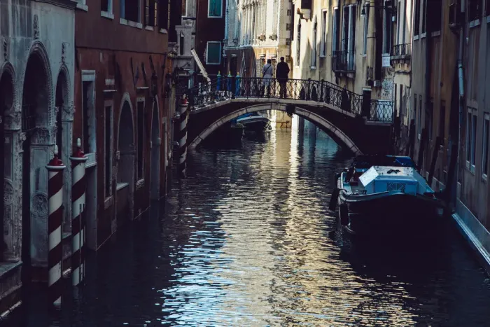 Framed Print : Couple standing on the bridge above canal in Venice, Italy Framed Print : Couple standing on the bridge above canal in Venice, Italy