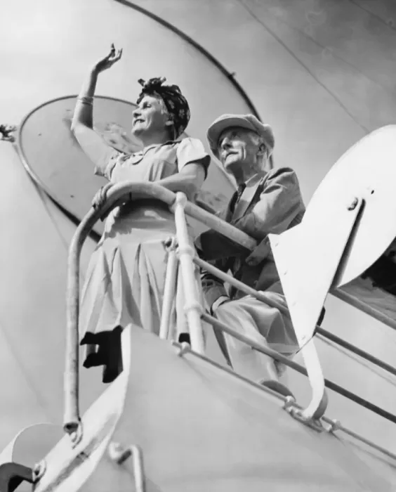 Framed Print : Couple standing at railing on cruiser deck (B&W), (low angle view)