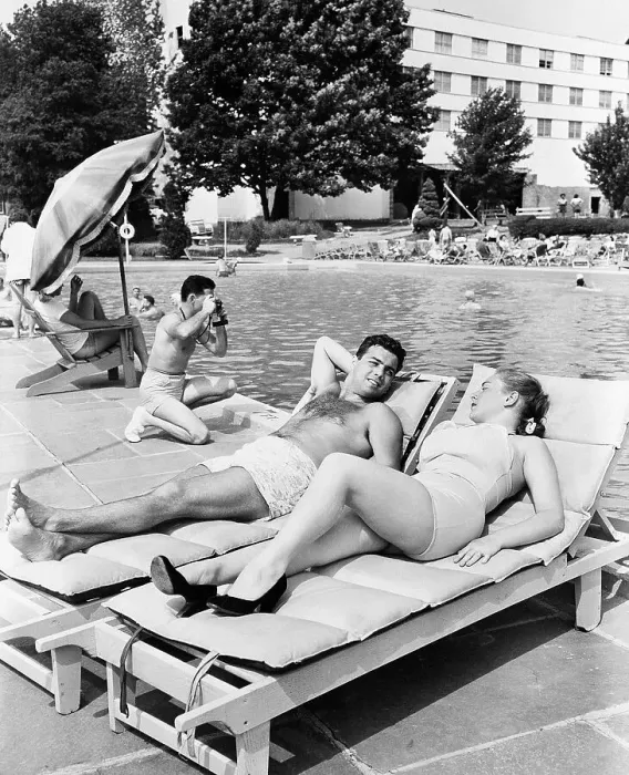 Framed Print : Couple Sunbathing Poolside Framed Print : Couple Sunbathing Poolside