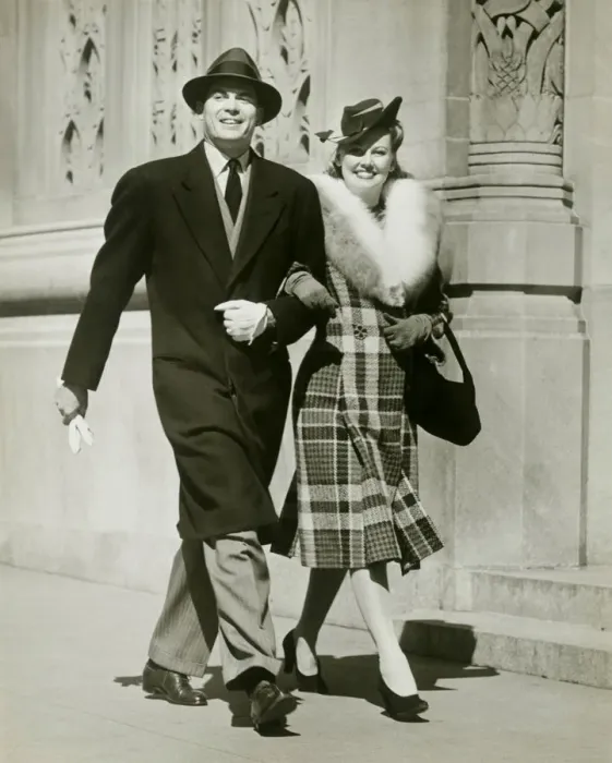 Framed Print : Couple walking arm in arm in street Framed Print : Couple walking arm in arm in street