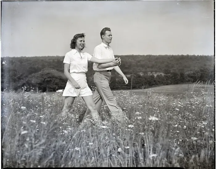 Framed Print : Couple Walking Through Flower Field Framed Print : Couple Walking Through Flower Field