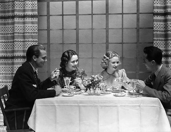 Two couples dining in club restaurant