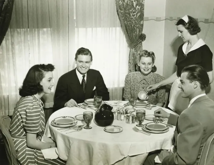 Framed Print : Two couples having dinner, maid pouring soup, (B&W) Framed Print : Two couples having dinner, maid pouring soup, (B&W)
