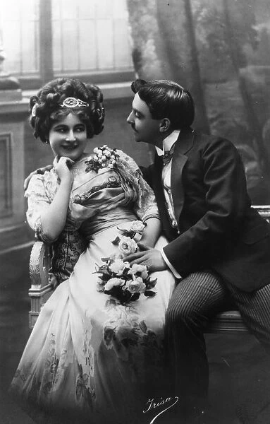 Courting. circa 1890: A courting Victorian couple fawning over each other