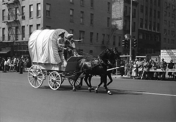 Covered Wagon on street during parade