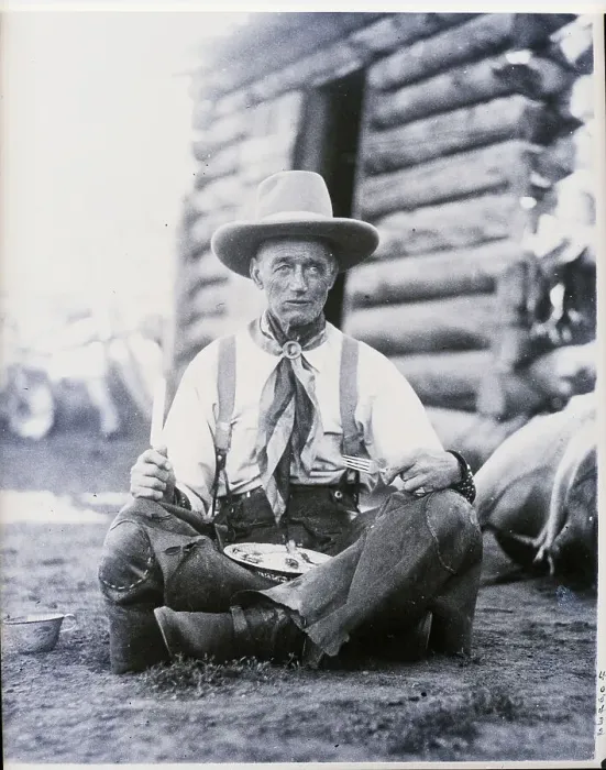 Framed Print : Cowboy Seated Indian Style Eating Framed Print : Cowboy Seated Indian Style Eating