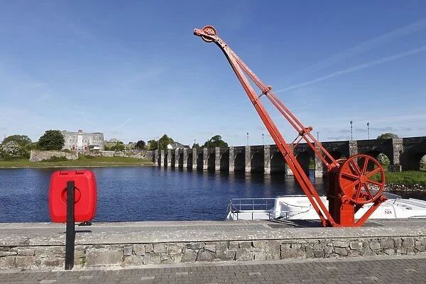 Crane on a jetty, Old Fort and old bridge over the River Shannon, Shannonbridge, County Offaly and Roscommon, Ireland, Europe