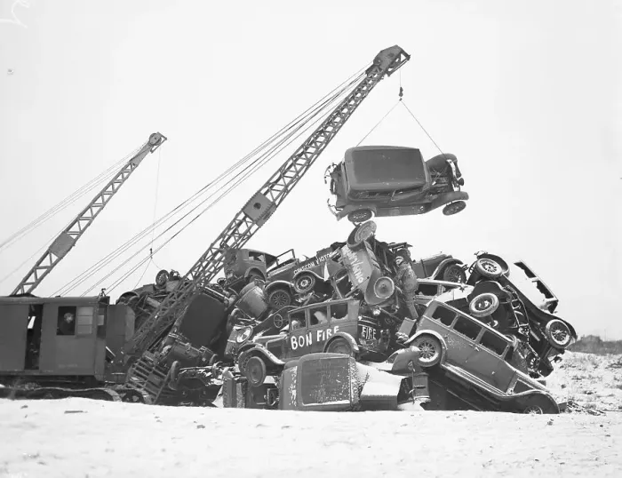 Framed Print : Crane Stacking Up Old Cars to be Burned in a Bonfire Framed Print : Crane Stacking Up Old Cars to be Burned in a Bonfire