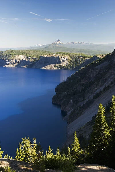 Crater Lake And Distant Volcanic Mountains
