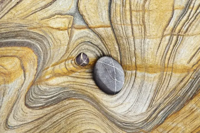 Framed Print : Creation. Natural patterns and shapes made in the rocks by the continuing Framed Print : Creation. Natural patterns and shapes made in the rocks by the continuing