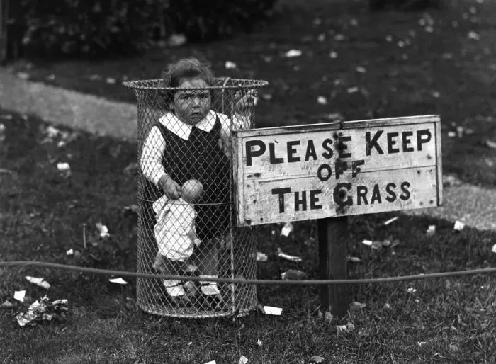 Framed Print : Creche. 1st October 1928: A child standing in a park rubbish bin Framed Print : Creche. 1st October 1928: A child standing in a park rubbish bin