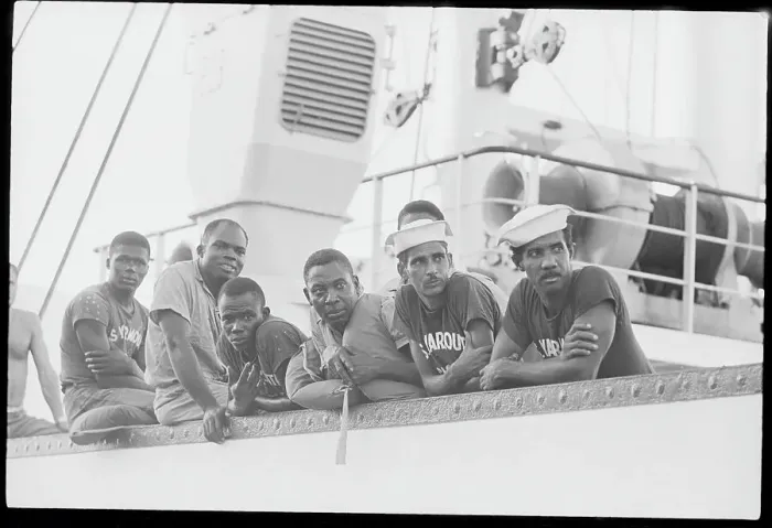 Framed Print : Crew Men Leaning On Rescue Boat