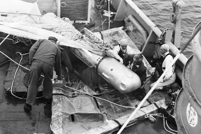 Framed Print : Crewmen Tie Down Bomb Recovered From Sea Framed Print : Crewmen Tie Down Bomb Recovered From Sea