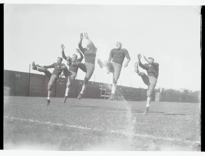 Framed Print : Crimson Teammates Working out on Field Framed Print : Crimson Teammates Working out on Field