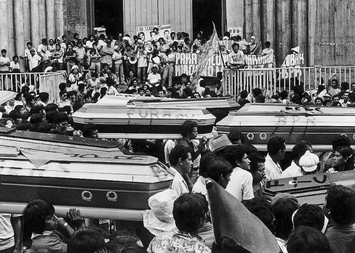 Framed Print : Crowd Carrying Coffins Through Street