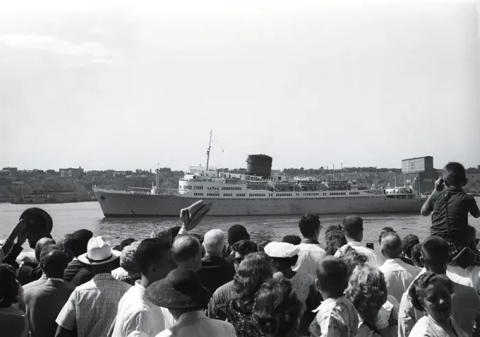 Framed Print : Crowd in harbor waiting for steamship Framed Print : Crowd in harbor waiting for steamship