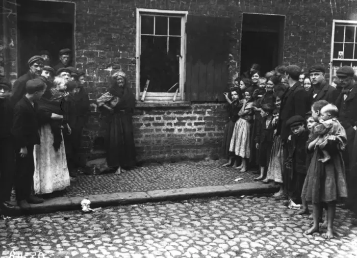 Framed Print : A crowd inspects damage to a house by a regiment of soldiers at Donegal Quay