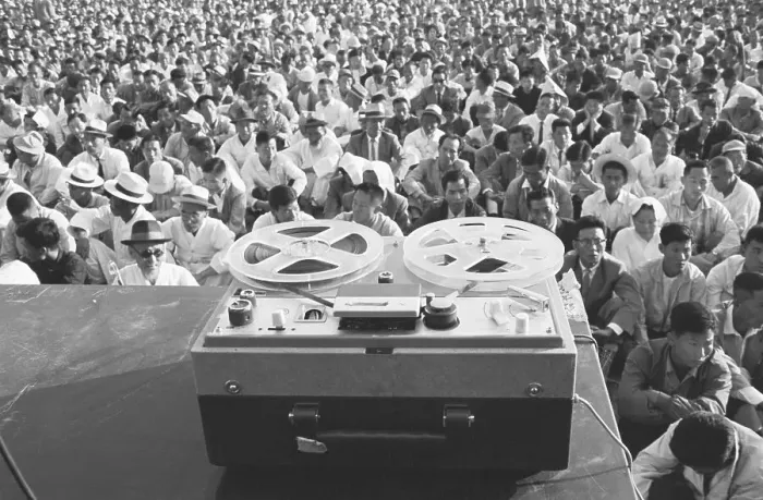 Framed Print : Crowd Listening to Tape Recording Framed Print : Crowd Listening to Tape Recording