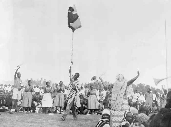 Framed Print : Crowd Observing the Raising of New Tanganyika Flag
